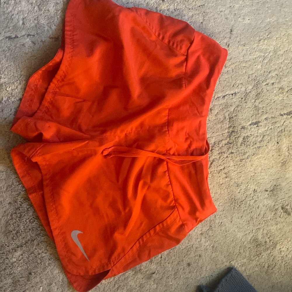 red nike running shorts
